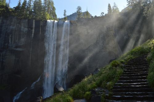 waterfall cliff sunbeams