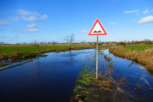 waterway flood road sign