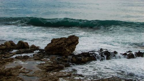 wave smashing rocky coast