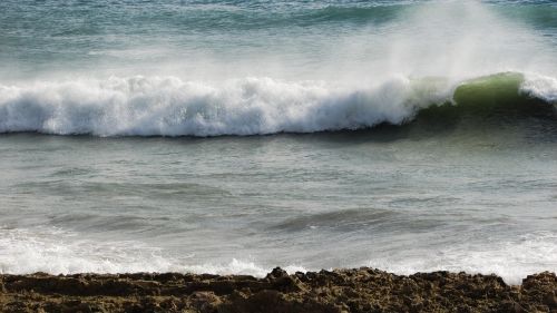 wave smashing beach