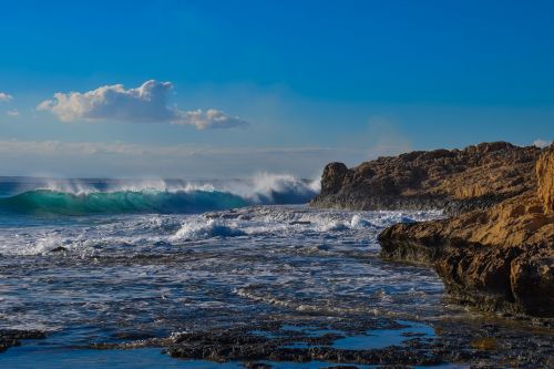 wave smashing rocky coast