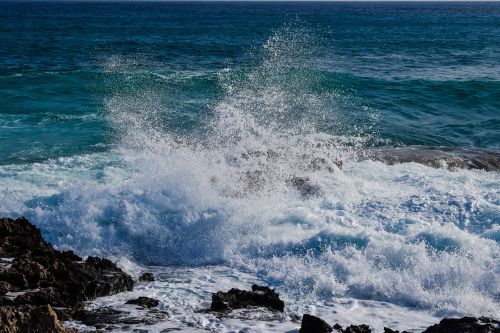 wave smashing rock
