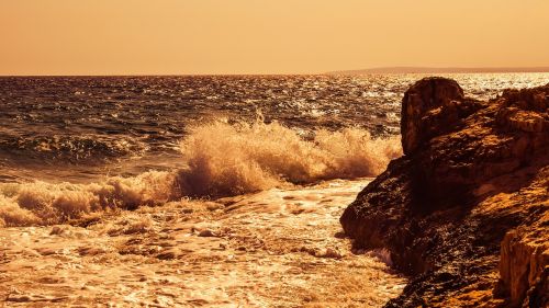 wave smashing rocky coast