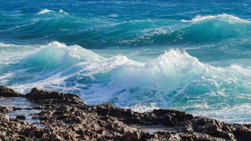 wave crushing rocky coast