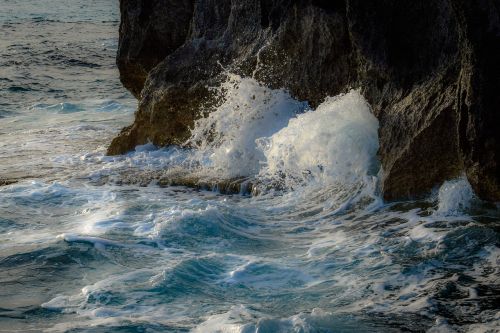 wave crushing rocky coast