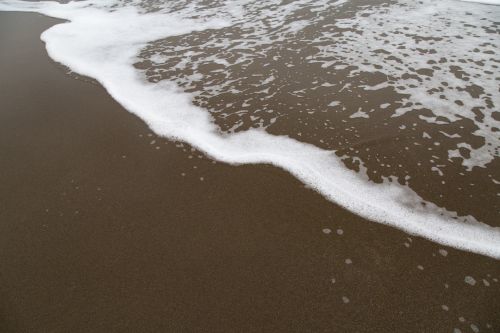 Wave On The Sea On The Sand Beach