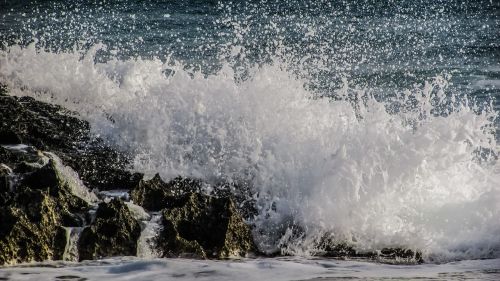 waves rocky coast smashing