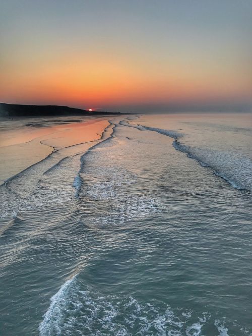 waves beach sunset
