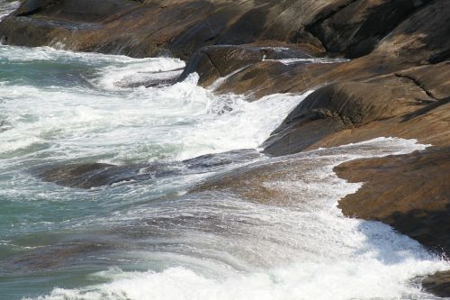 waves stones beaches