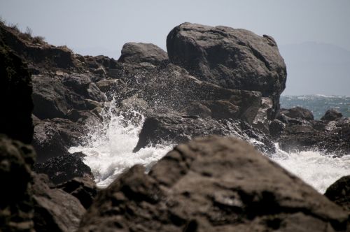 Waves Crashing Through Rocks