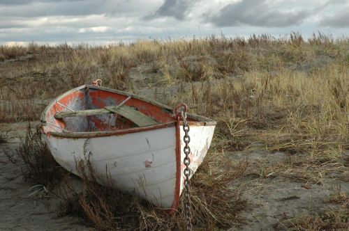 weathered rowboat abandon boat beach