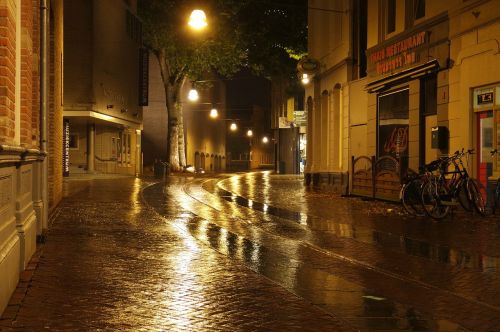 wet street night reflections