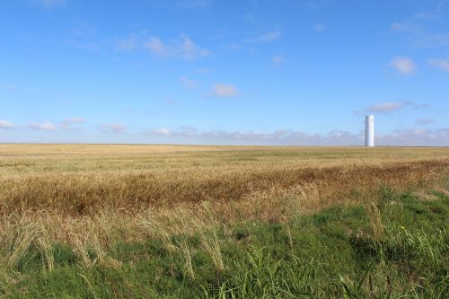 wheat water tower blue sky