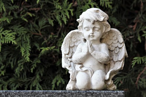 white angel  praying  statue