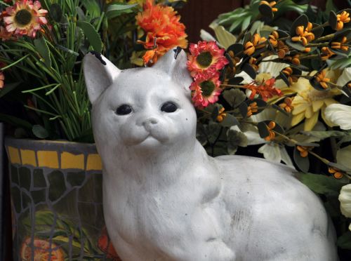 White Ceramic Cat In Garden