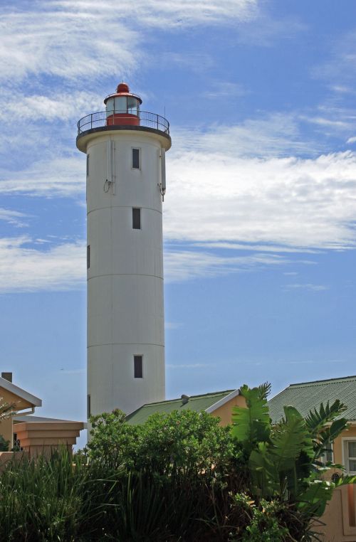 White Lighthouse Against Blue Sky