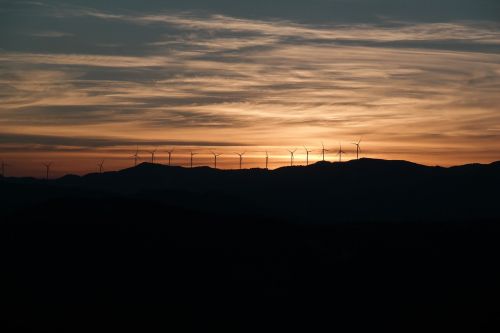 wind farm windmill red cloud