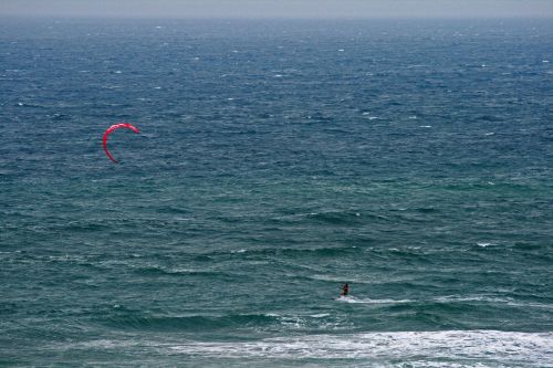 Wind Surfer With A Red Canopy