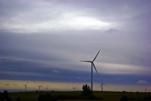 wind turbines against dark clouds  wind  power