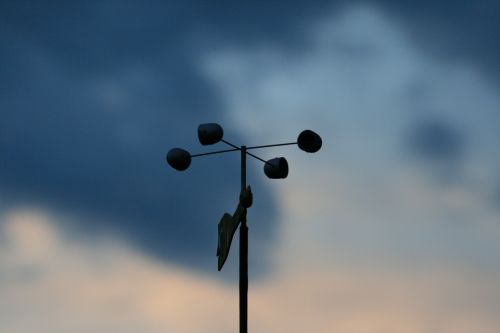 Wind Vane Against The Sky