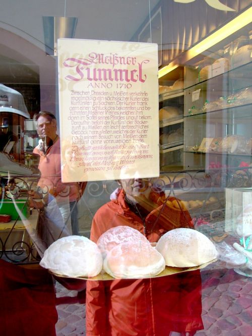 window mirroring pastry shop