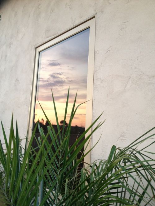 window reflection sunset