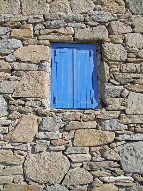 window blue stone wall