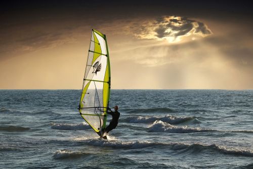 windsurfing sea clouds