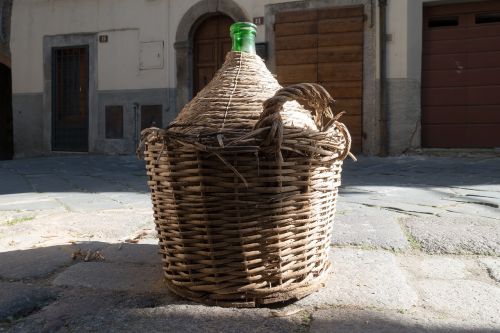 wine balloon raffia basket transport