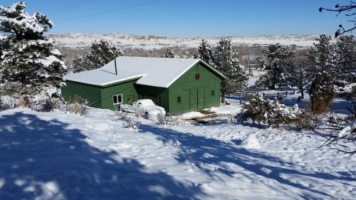 winter scene green barn colorado