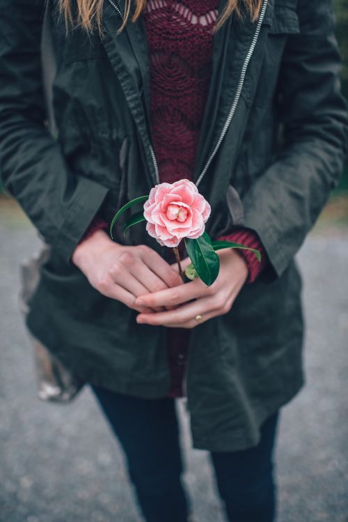 woman holding flower