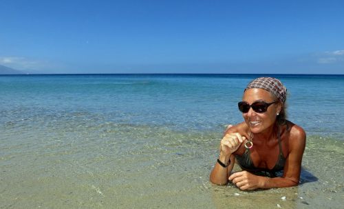 woman sunbathing water