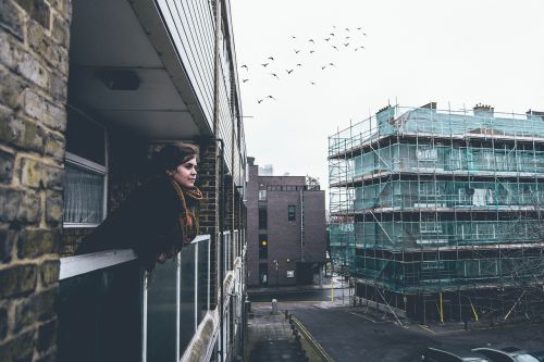 woman balcony city