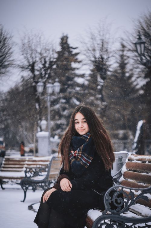 woman bench winter