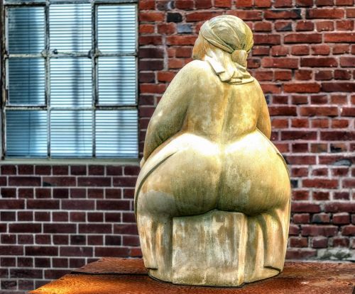 woman sculpture sit