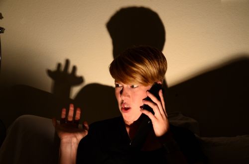 woman shadow phone call