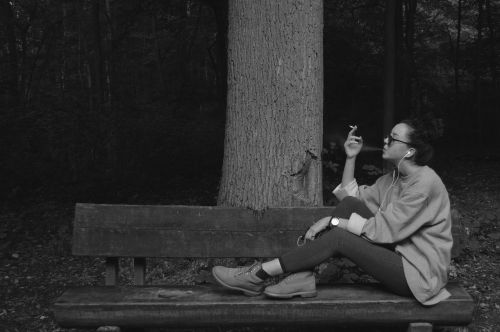 woman black and white bench