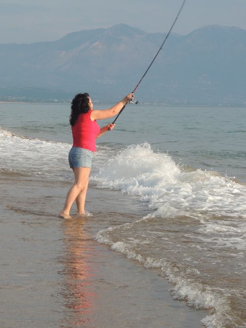 woman fishing sea