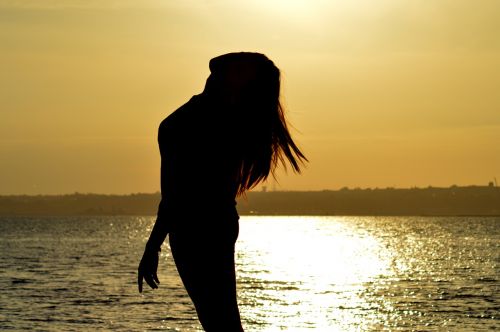 woman silhouette sun