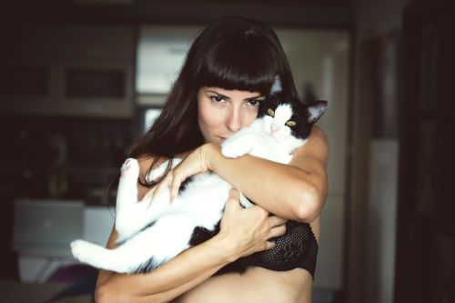 woman holding cat