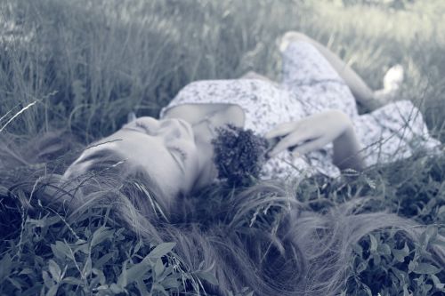 woman sleeping grass
