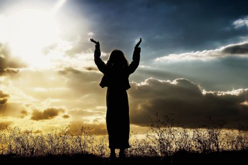 Woman Praising Sunset