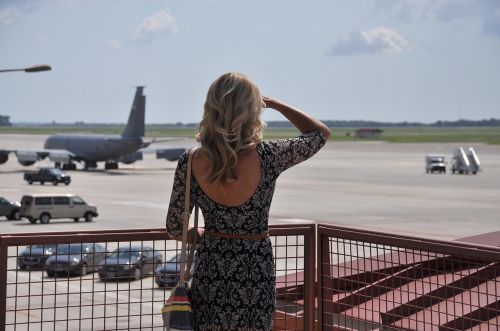woman watching airport waiting