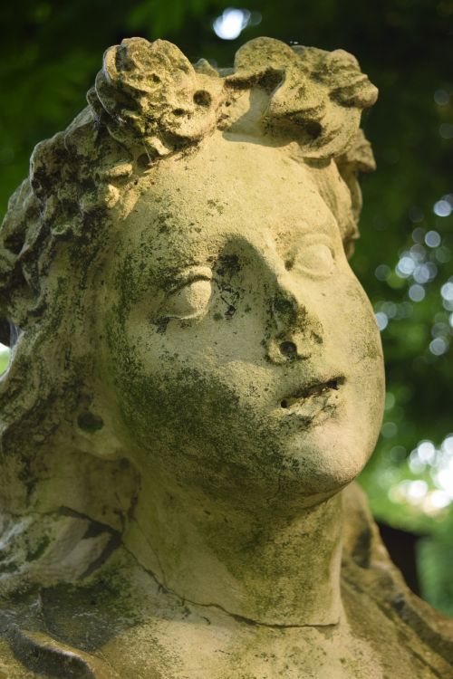 woman's head statue stone