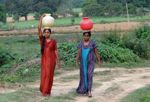 women village fetching water