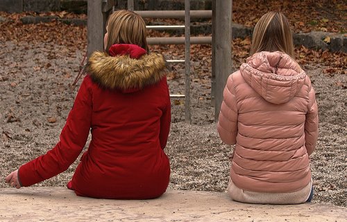 women  sit  playground