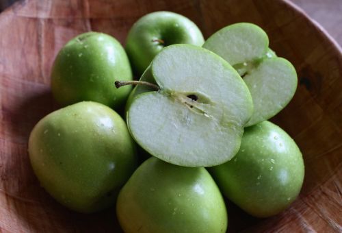 wood bowl green apples green
