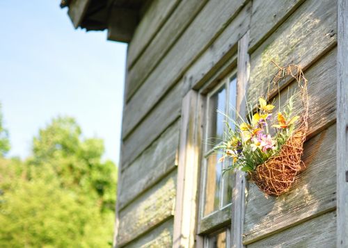 wood house rural basket of flowers