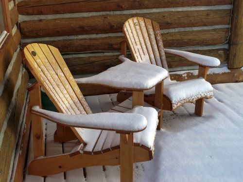 wooden garden chairs snow covered