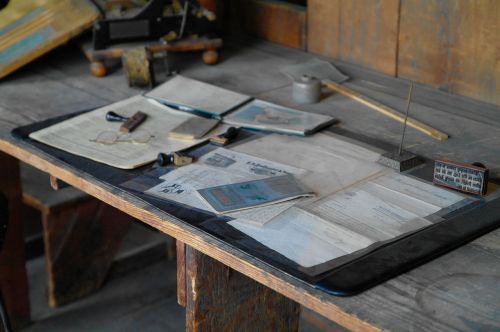 wooden table papers